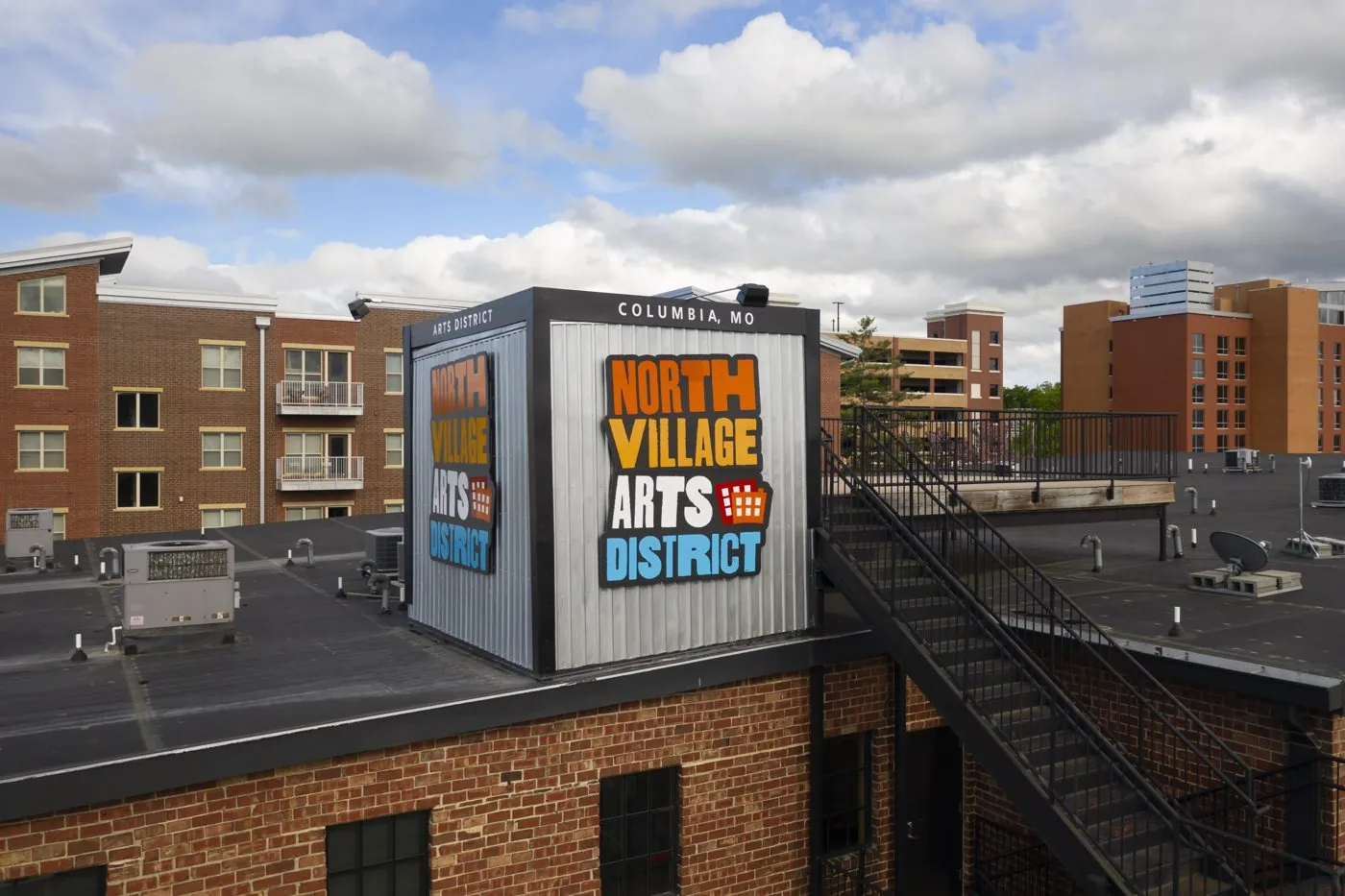 North Village Arts District sign on a rooftop in downtown Columbia, Missouri